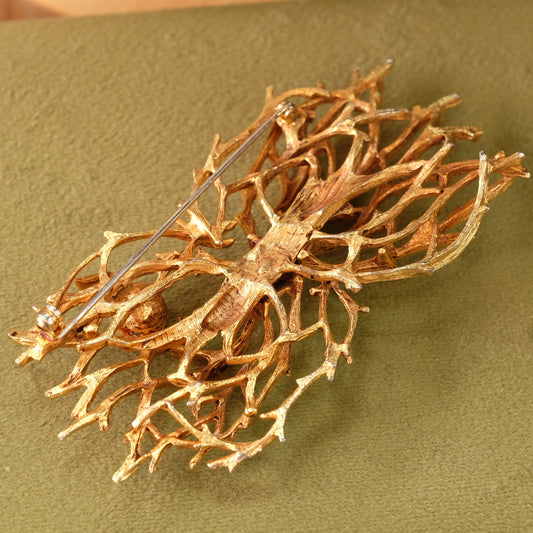 Designer web on branches with faux pearl brooch