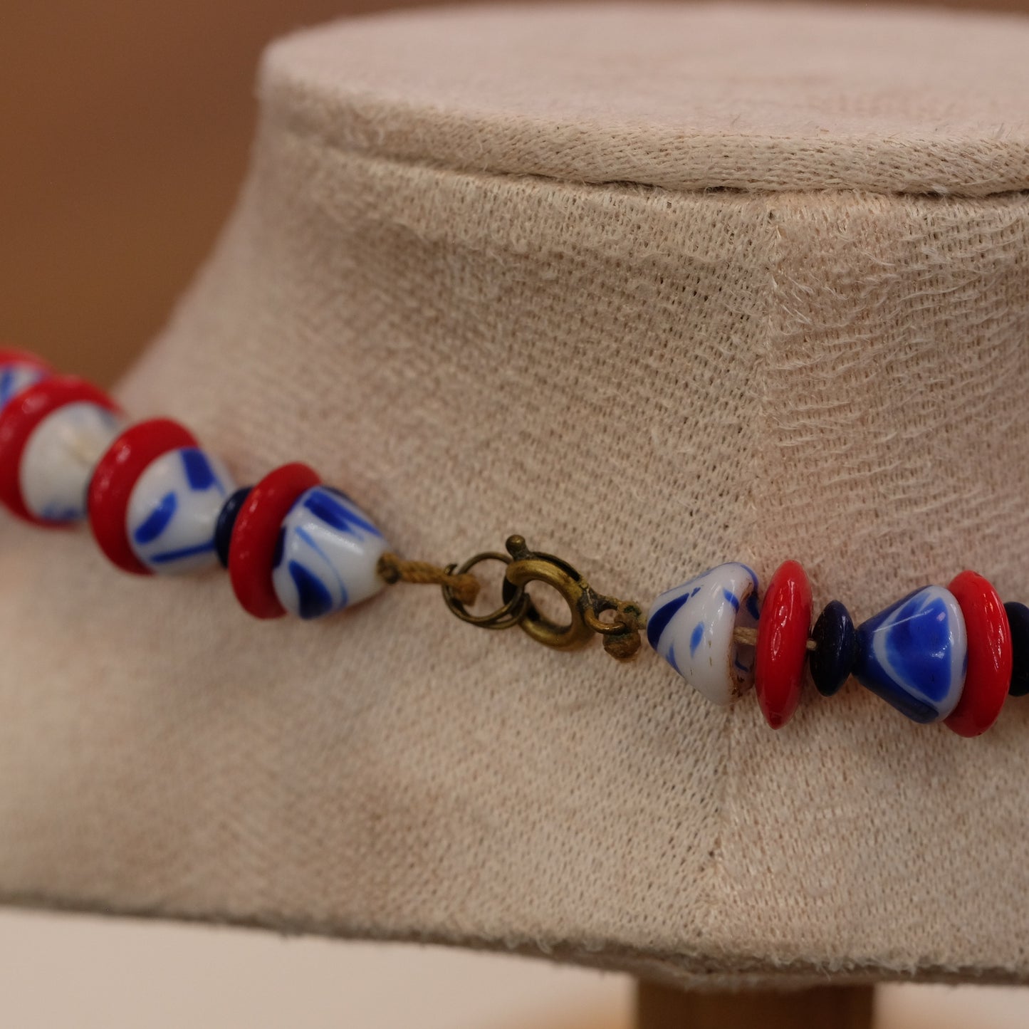Vintage triangular glass bead red, blue, white