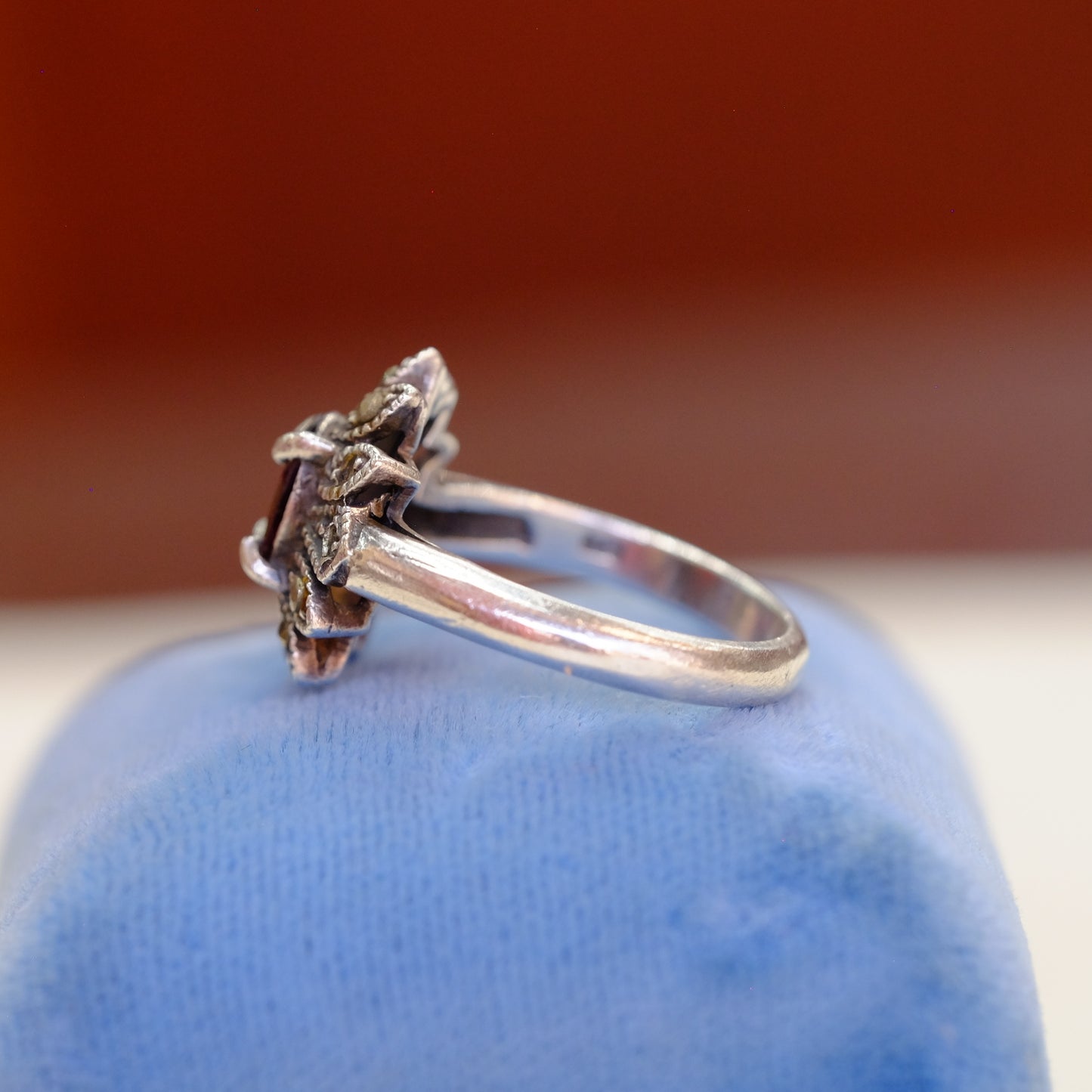 Silver Floral Motif Ring with Garnet