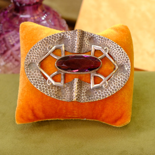 Early Sash Brooch hammered silver with purple glass
