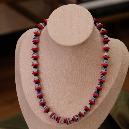 Vintage triangular glass bead red, blue, white