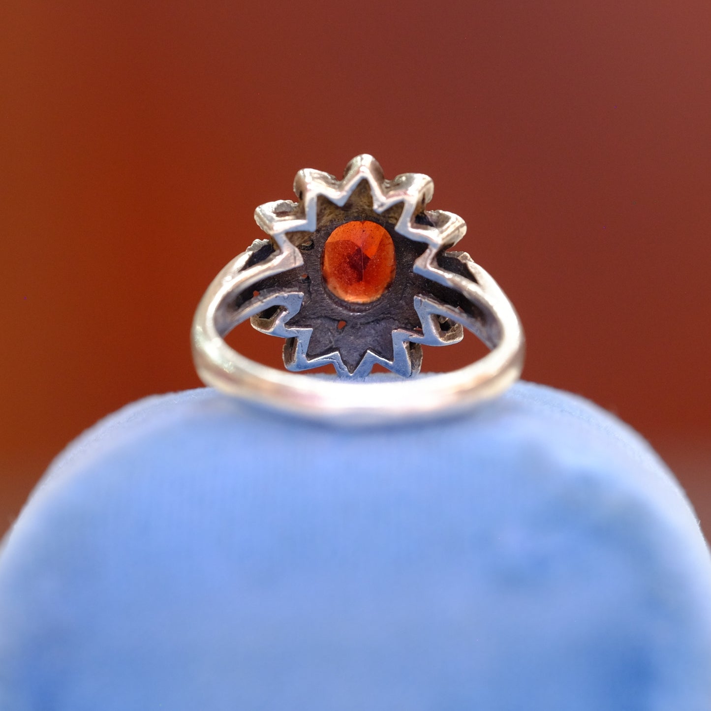 Silver Floral Motif Ring with Garnet