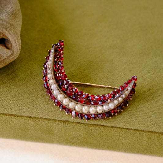 Victorian garnet and pearls crescent brooch signed 900