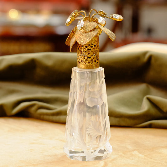Carved crystal atomizer with gold tone jeweled top