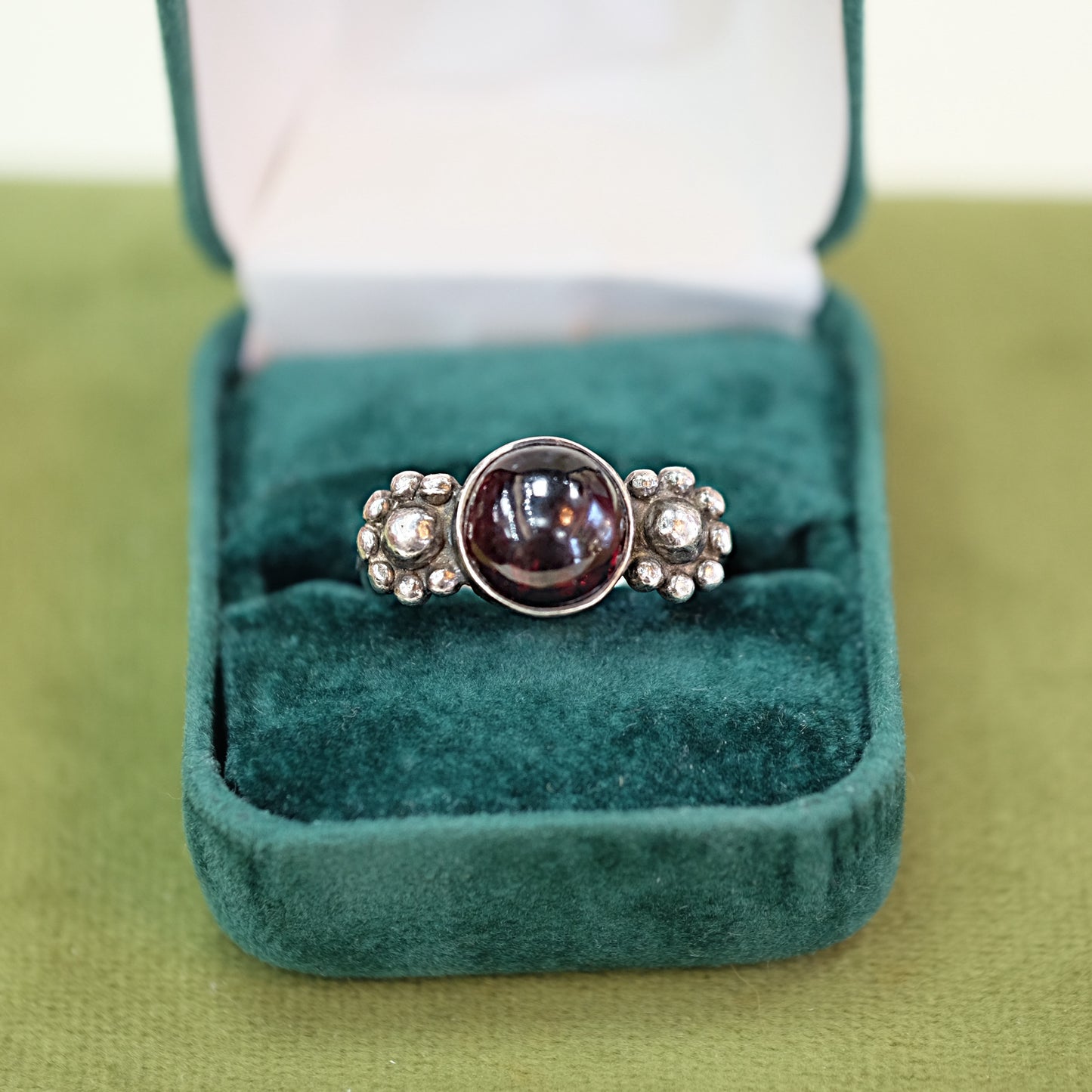 Round Garnet Ring with Floral Setting