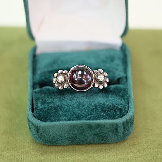 Round Garnet Ring with Floral Setting