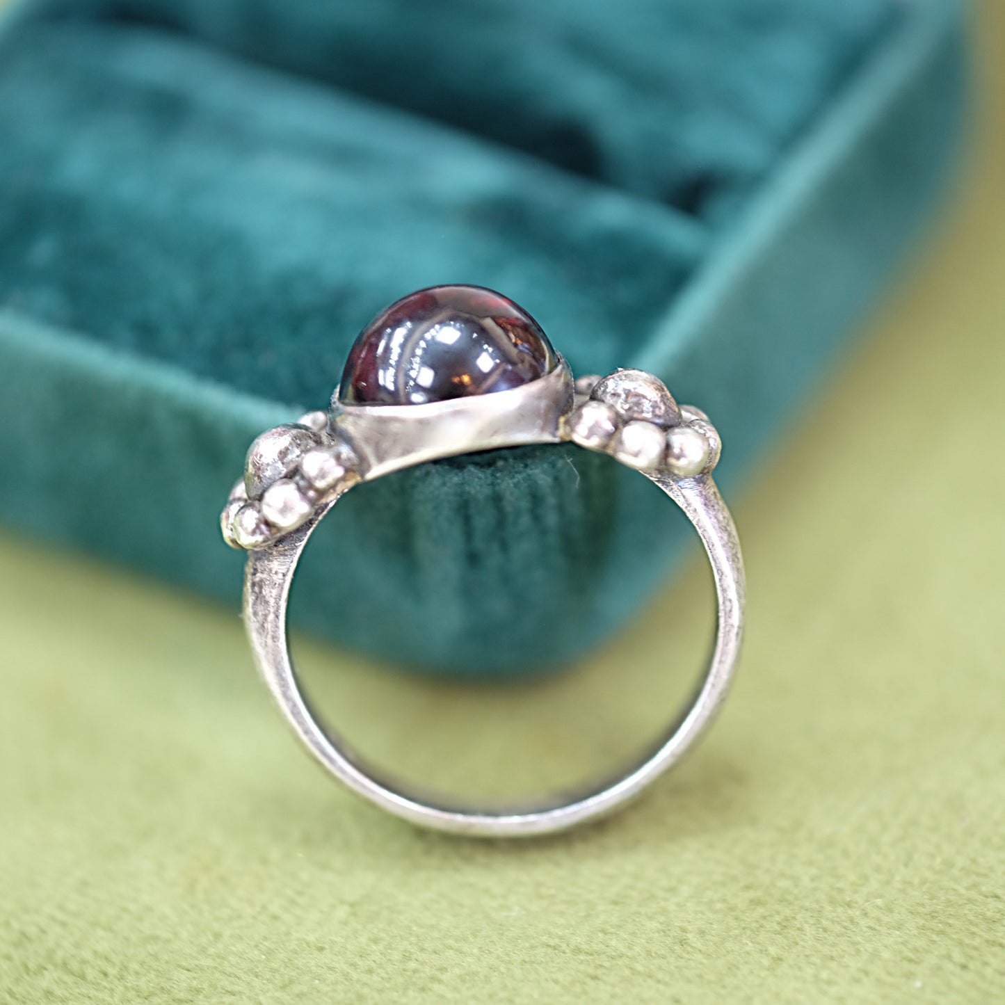Round Garnet Ring with Floral Setting